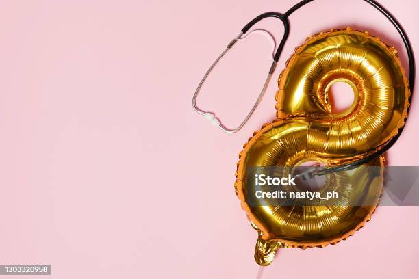 Stethoscope And Ballon Number Eight 8 On Pink Background International Womans Day Creative Medical Background Postcard Top View Flat Lay Copy Space Stock Photo - Download Image Now