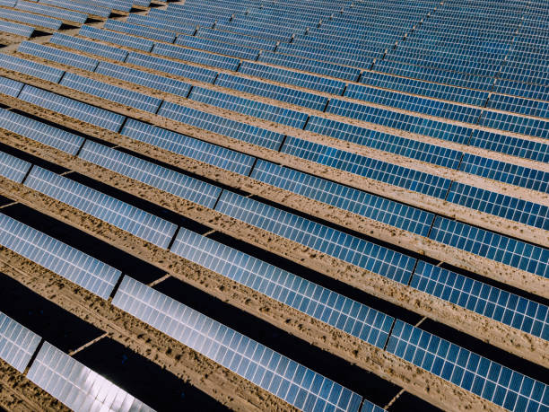 istock Drone Point View of Solar Panels in Desert 1303321147