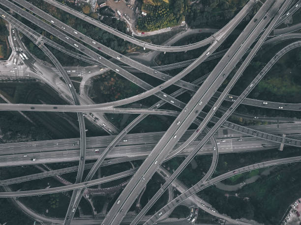 istock Aerial View of Complex Overpass and Busy Traffic 1303321383
