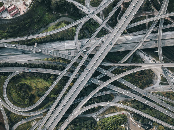 istock Aerial View of Complex Overpass and Busy Traffic 1303321513