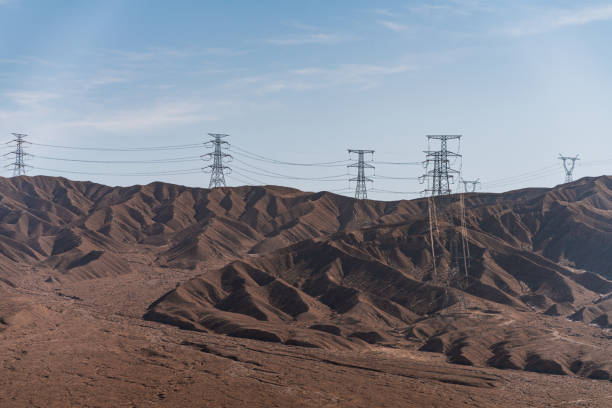 istock Electric Power Lines and Tower 1303322427