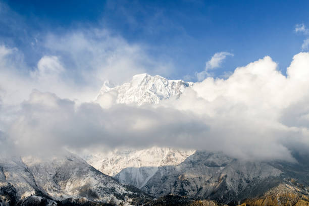 istock Annapurna III peak behind clouds, Annapurna Circuit 1303323466