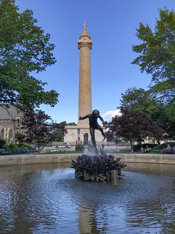 Baltimore, USA - May 6, 2019 - Located at Mount Vernon Square, an historic neighborhood of Baltimore, The Washington Monument was completed in 1829. The 178 foot monument  holds a ground-floor gallery offering digital exhibits about the construction of the Monument, the history of Mount Vernon and of the life and accomplishments of George Washington.