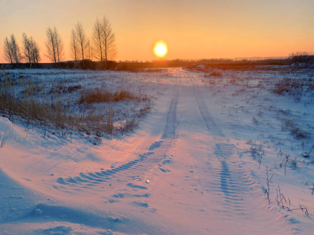 istock Car tracks on the snow 1303327412