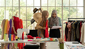 Both Muslim women run a small business in their own homes. Is the design and tailoring of clothes.