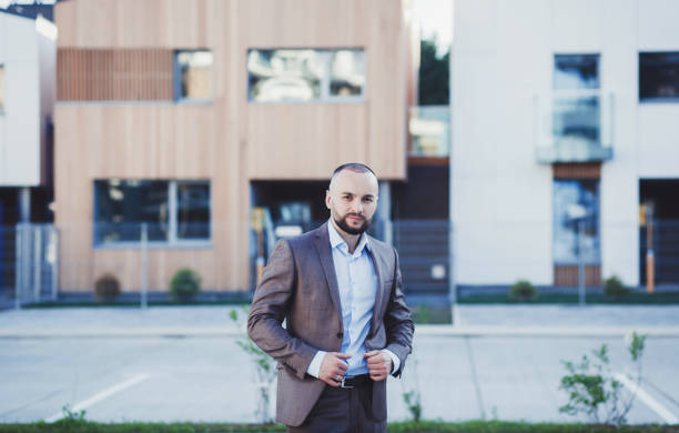 istock professional young Real Estate Agent in suit 1303328350