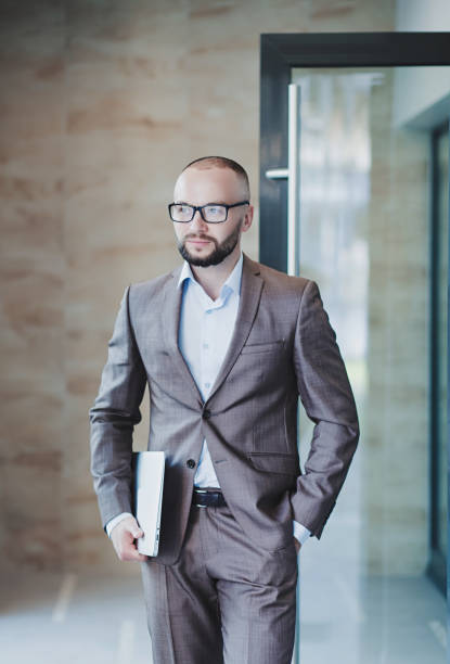 istock a successful man in glasses 1303328374