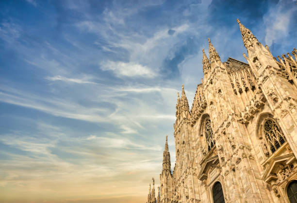 istock Milan Cathedral (Duomo di Milano) with blue sky and sunset light 1303330126