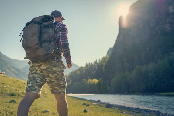 istock hiker man walking in the mountains 1303332912