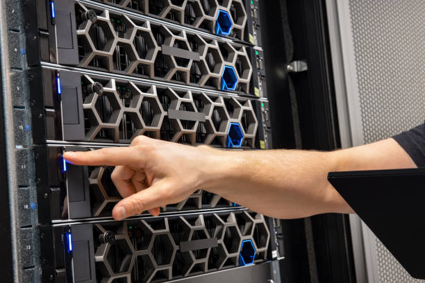 istock Hand Of Male Technical Consultant Examining Hardware In a Hyperconverged Datacenter Environment 1303332961