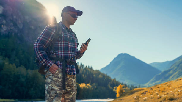 istock hiker men using smart phone in the mountains in the countryside 1303332971
