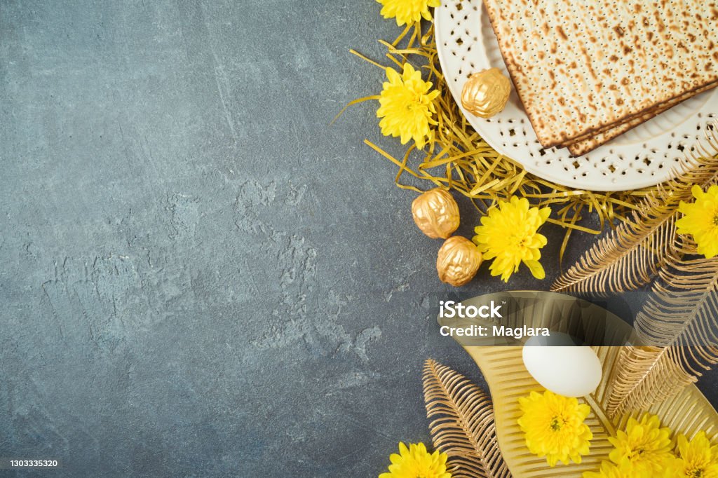 Jewish Holiday Passover Concept With Matzah Seder Plate And Golden