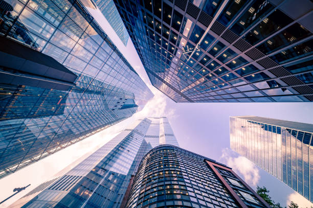 Abstract modern business buildings in London city's financial district - creative stock image stock photo