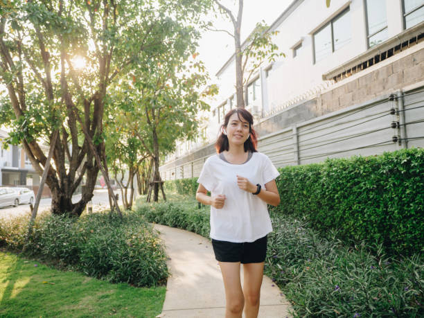 istock Woman running in park 1303336355