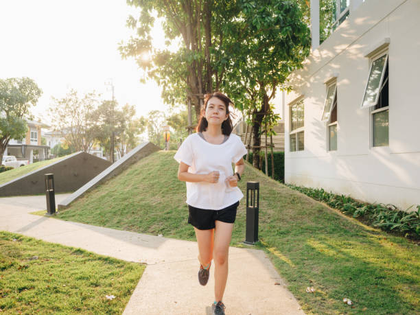 istock Woman running in park 1303336499