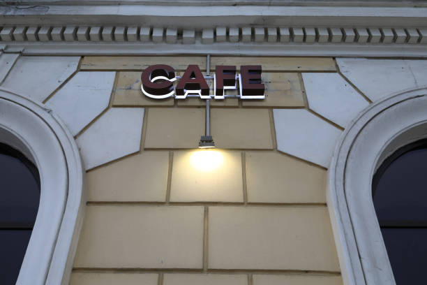 istock Cafe signboard on wall of building 1303337821