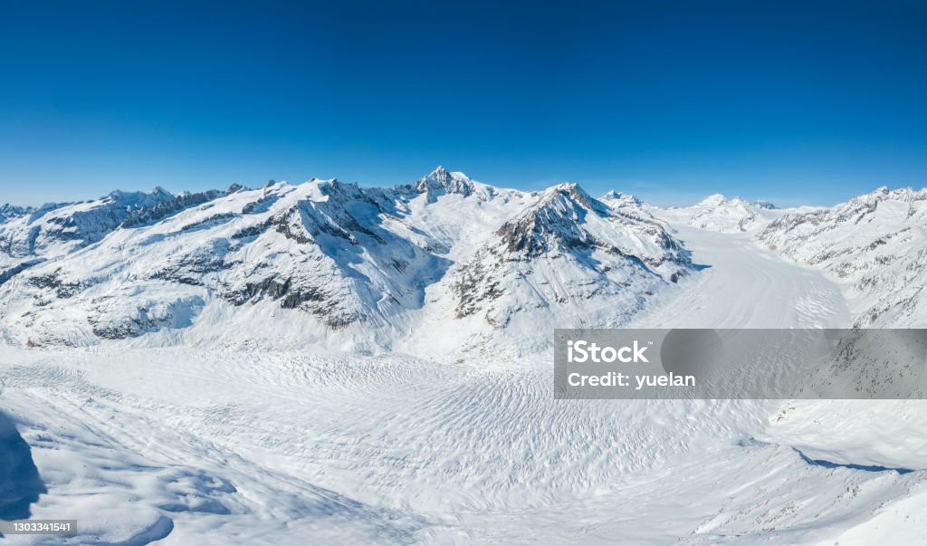Aerial panorama of Great Aletsch Glacier in winter, Switzerland Aerial panorama of Great Aletsch Glacier in Alps winter season, covered with deep snow, Switzerland, which is a unesco heritage (stitched large file) Winter Stock Photo