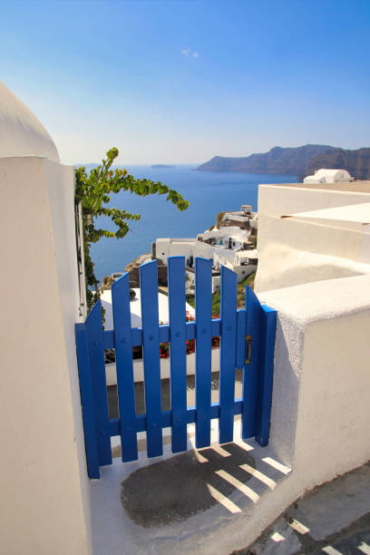 Greece. Santorini. Thira island. Closed wicket on the promenade. Seascape from the height of the caldera