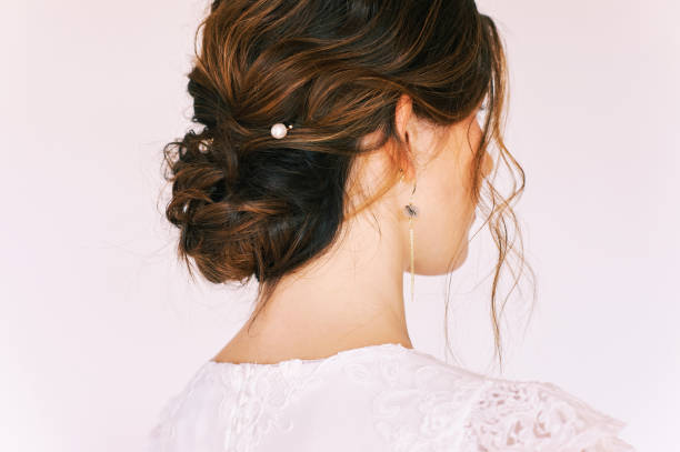 istock Romantic formal hairstyle on brown hair, back view 1303343635