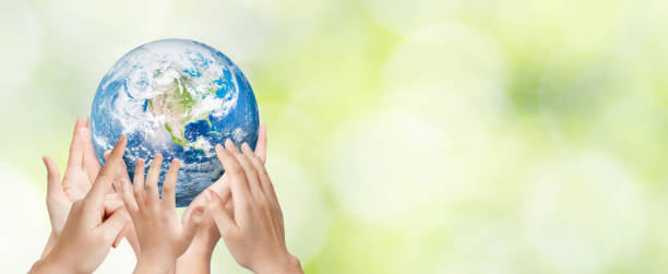 istock Earth globe in family hands. World environment day 1303343963