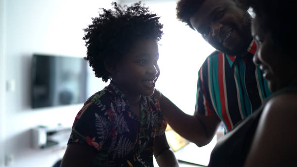 istock Happy family talking in the kitchen at home 1303344794