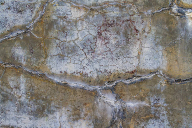 istock Concrete wall that is heavily cracked with age 1303344896