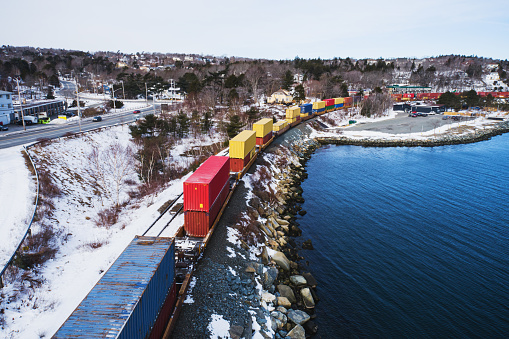 Low level drone view of a freight train on a cold February afternoon.
