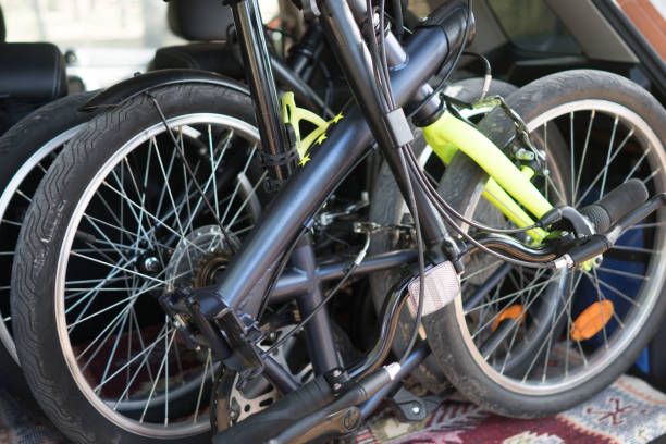 istock Folding bikes standing in the trunk of the car. 1303346425