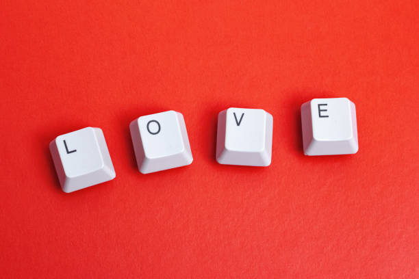 istock Word love made of keyboard keys on red background 1303347840