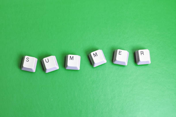 istock Word summer made of cubes on green background 1303348331
