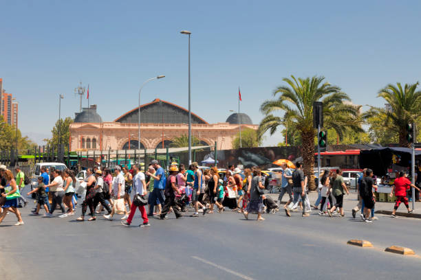 Crowd of People Crossing Street in Santiago de Chile stock photo