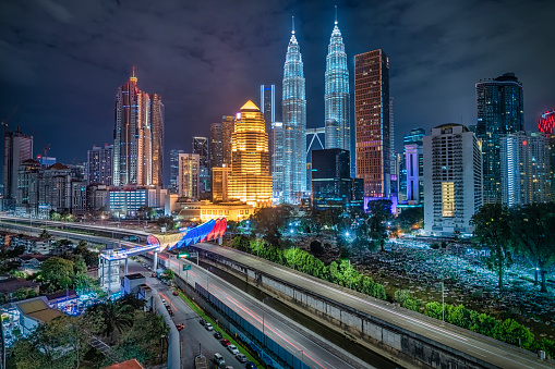 Kuala Lumpur Cityscape at night with saloma bridge connection in between old town and new city buildings across highway