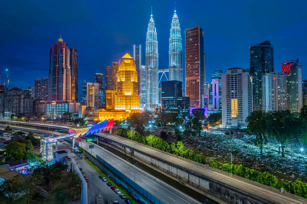 Photo of Kuala Lumpur Cityscape at night with saloma bridge connection in between old town and new city buildings across highway