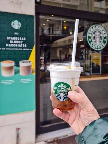 Thessaloniki, Greece - February 20 2021: Starbucks Cloud Macchiato takeaway coffee cup with a straw-less lid.
