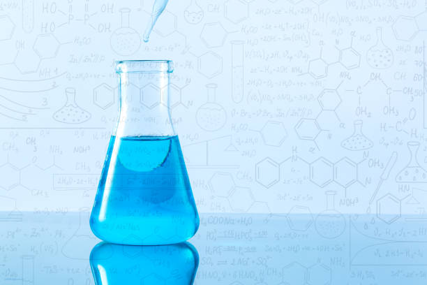 istock A studio photo of a Erlenmeyer Flask,Hand drawn science formulas on chalkboard for background 1303351608