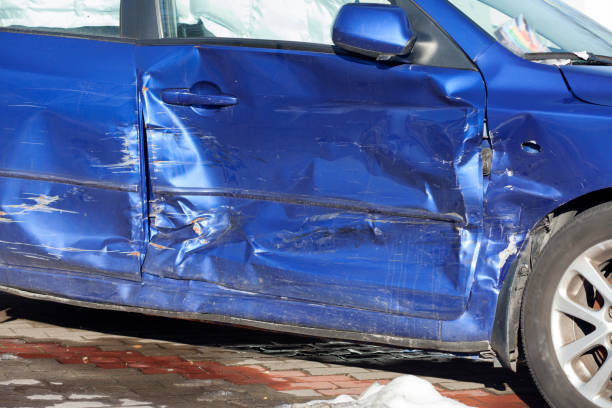 istock Car accident, dented side of the car, side curtain airbag deployed 1303351800