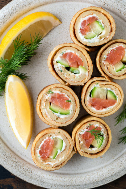 istock Crepe salmon rolls with cucumber and cream cheese 1303351834