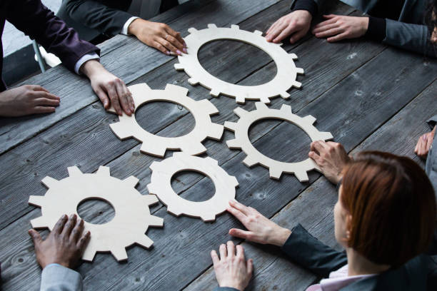 istock Business people connect gear 1303353079