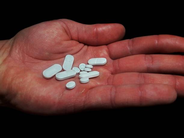 istock Antidepressants drug pills on man palm 1303353607