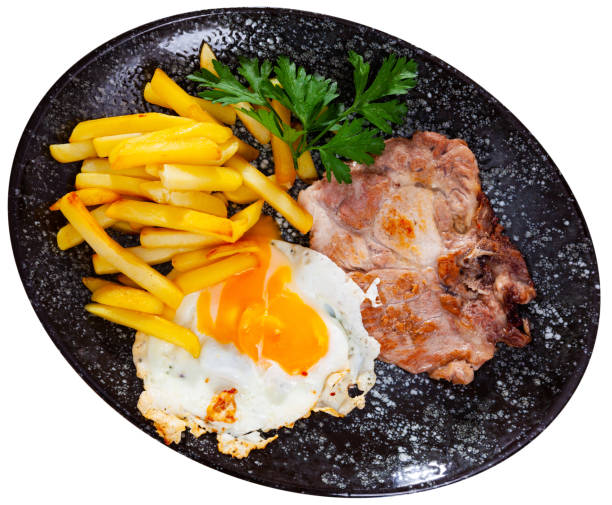 istock Meat and potatoes served with fried egg decorated with  parsley leaf 1303354466