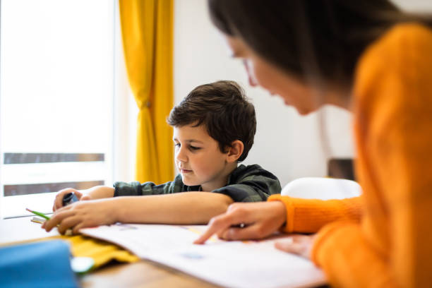 istock A mother homeschooling her son 1303357049