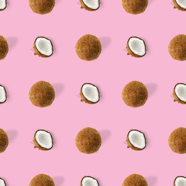 istock coconut Seamless pattern. Tropical abstract background with isolated Coconut on pink background. flat lay. 1303357276