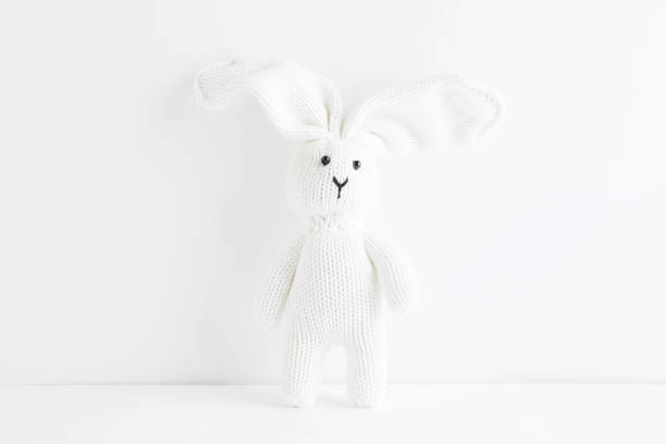 White rabbit on white background White toy knitted bunny isolated on white background fluffy rabbit stock pictures, royalty-free photos & images