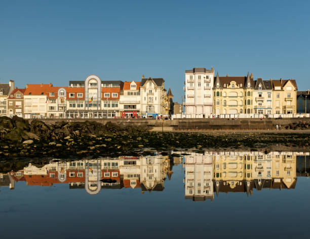 Seafront of Wimereux reflected on the beach of the French Opal Coast stock photo