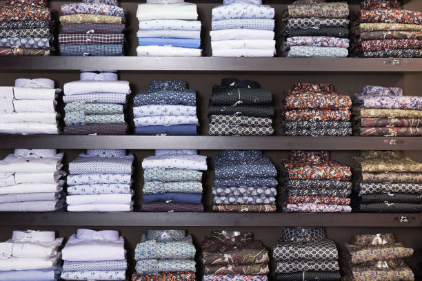 istock Men shirts displayed on shelves in shop 1303359796