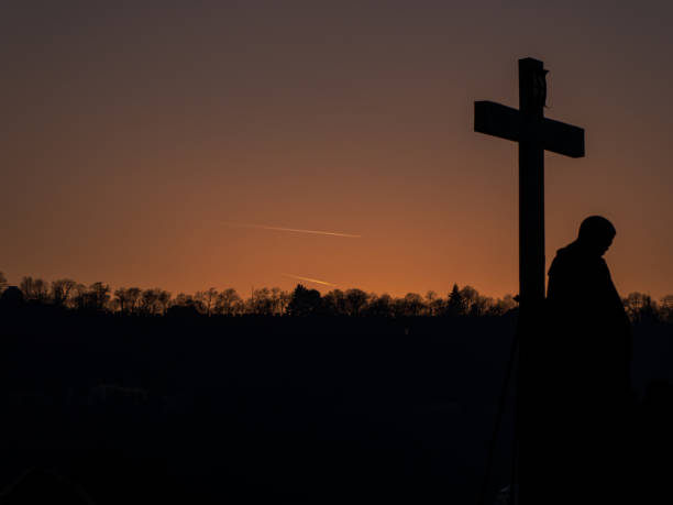 istock Silhouette of a crucifix at dusk 1303361026