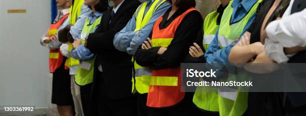 Large Group Of Factory Worker Standing Together In Warehouse Or Storehouse Stock Photo - Download Image Now