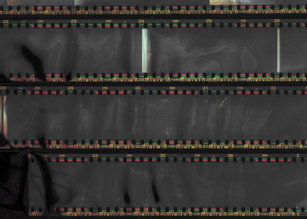 underexposed 35mm filmstrips on dark background.