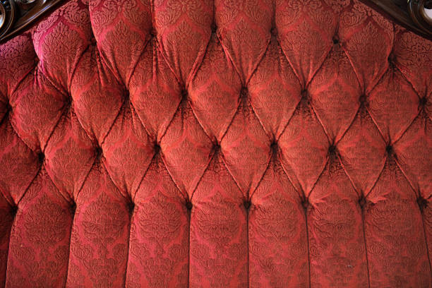 istock Seating back texture of a red rococco inspired sofa.. 1303363984