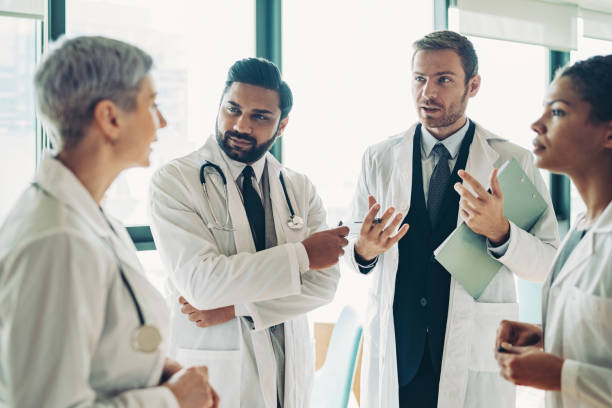 istock Multi-ethnic group of doctors having a discussion 1303365597